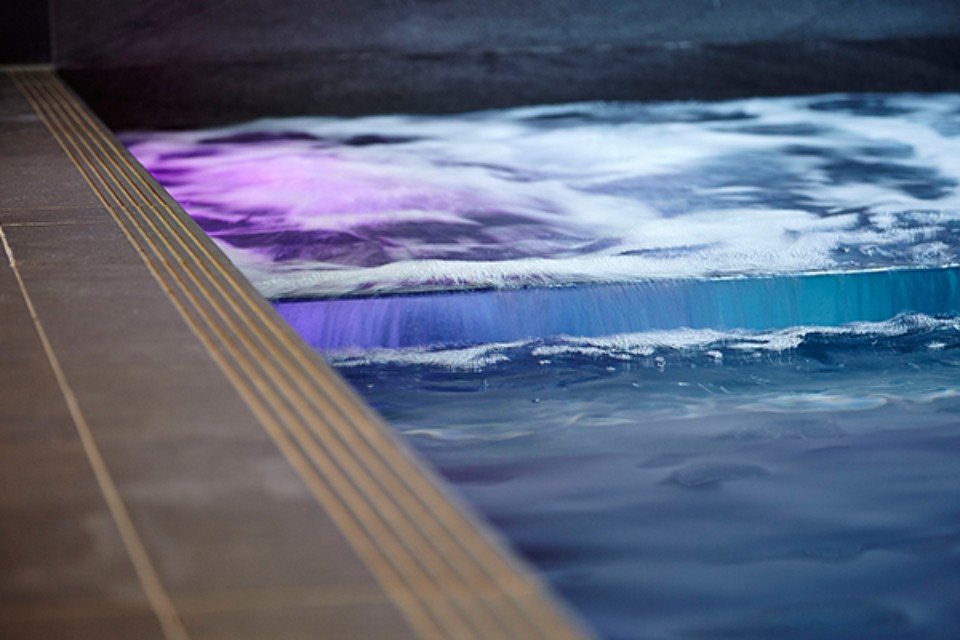 Essential-maintenance-tips-for-your-swimming-pool Swimming pool being cleaned