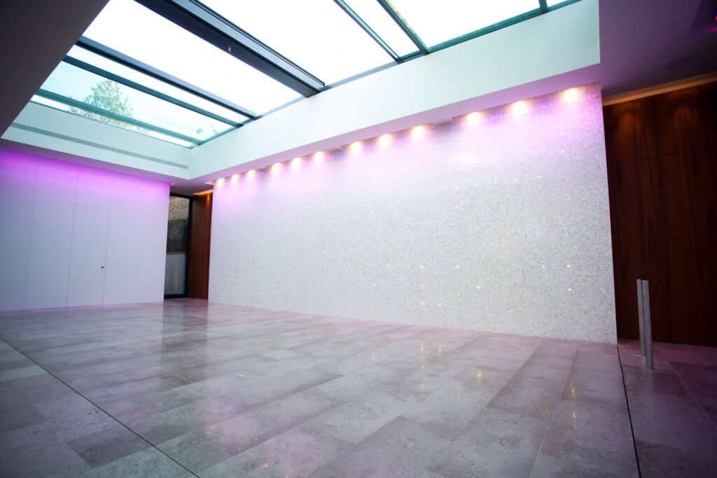 marble tilled floor with white glitter walls and pink lighting