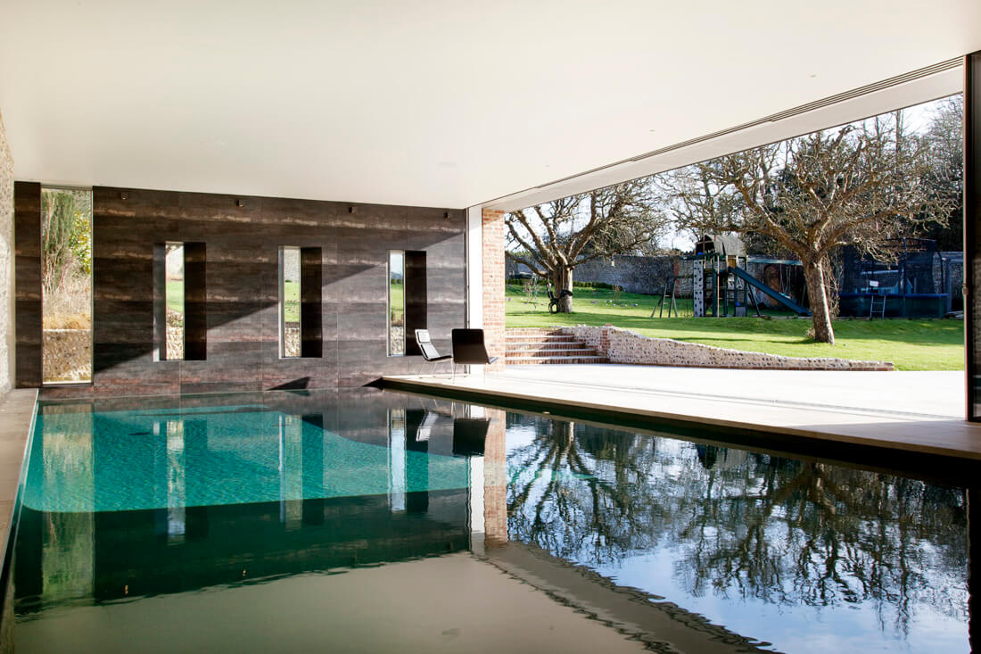 Have you been considering an indoor swimming pool for your property? A swimming pool can be a stylish and functional addition to your family home. Here are 4 reasons to take the plunge. Prioritise your health and wellbeing for 2023 As we approach a new year, many of us will make resolutions to lead a healthier lifestyle, and swimming offers various health benefits. Swimming is good exercise and can help to improve circulation, which eases stress and boosts endorphin levels. The calming effect of swimming can set you up for the day ahead, or relieve stress and ease muscle aches at the end of a tough day. If one of your goals for 2023 is to improve your health and wellbeing, what better way than with a daily swim in the comfort of your own home?  An indoor swimming pool means you can swim comfortably all year round.  Create a space to share with family and friends  A luxury swimming pool isn’t just a place for exercise and relaxation. Guncast can design and build a swimming pool, that suits your home and lifestyle. We can help you create a space to enjoy with your family and friends, all year round. Whether you’re using your swimming pool to host fabulous parties with friends, or to teach your children to swim, lasting memories will be made.  The Guncast experts design and build beautiful swimming pools that can transform your home, to entertain family and friends for years to come. Add value to your property with a basement swimming pool If space is an issue when considering an indoor swimming pool, how about a basement pool? Many high-end properties located in busy cities such as London, simply don’t have the space to fit a swimming pool anywhere other than in the basement. Guncast has over 40 years’ experience in designing and building luxury basement swimming pools in the UK and beyond, creating stylish installations to complement high-end properties. Another creative use of space is a moving floor swimming pool. It gives you a multifunctional space, with or without a swimming pool, as required, at the touch of a button. Enjoy luxury design to suit your style and your home A well-designed swimming pool can transform your home. With luxury design, an extensive range of styles and finishes, and bespoke features to choose from, a Guncast swimming pool can be as unique as its owner. Swimming pools by Guncast are luxurious, beautiful, functional and finished to perfection. We use only the finest materials, including natural stone tiles such as marble, limestone, sandstone, and slate, as well as resplendent Italian glass mosaic or porcelain tiles. You can choose whatever suits your style and if you’re not sure our experts are always on hand to advise.  If you’re thinking of installing an indoor swimming pool at your property, be inspired by our portfolio, and contact the Guncast team to start planning.  