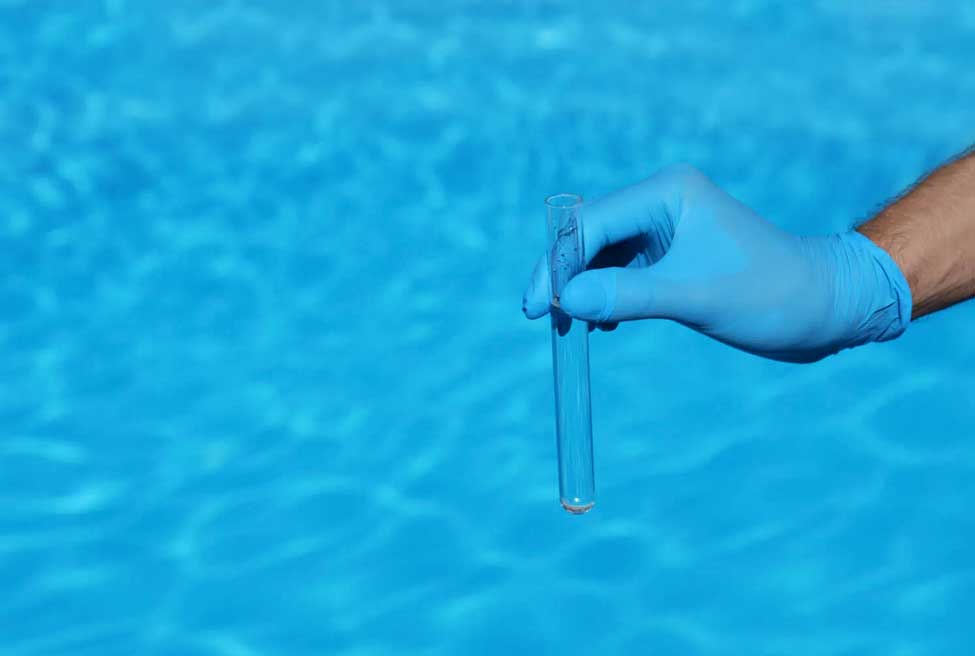 Swimming pool water being tested