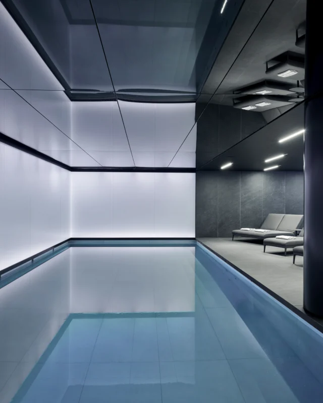 A Luxury Spa & Wellness Installation at art’otel London Hoxton.

At the heart of this stunning spa is a beautifully designed 12-metre swimming pool by Guncast, where elegance meets engineering. The pool’s serene surface reflects the surrounding architecture, while its clean lines and subtle lighting create a tranquil, immersive atmosphere. Four integrated underwater lights gently illuminate the water, enhancing the sense of calm and luxury.

Constructed using a spray concrete shuttering method (shotcrete), the pool is finished with a high-performance Steuler waterproofing membrane. Premium porcelain tiles were chosen for their durability and refined aesthetic, ensuring the pool remains as functional as it is visually striking. 

The installation required significant engineering expertise to adapt the existing building envelope and ensure structural integrity, watertightness, and long-term durability. 

Complementing this is a custom-built sauna and a luxurious steam room from @klafsuk.

#pooldesign #wellness #spadesign #luxurypools #luxuryhospitality