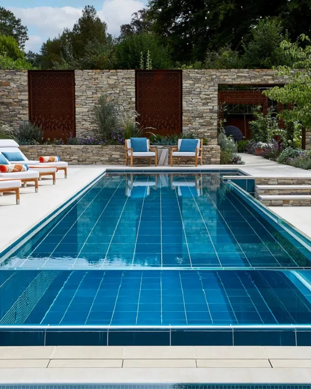 Where water, architecture, and landscape become one.

Infinity edge pools have evolved from luxury hotel features into defining elements of contemporary residential design.

When designed well, they don’t just sit within a space, they extend sight lines, reflect architectural language, and create a sense of stillness that transforms the entire environment.

This Surrey project is a visual masterpiece, centred around a transparent glass infinity edge that opens up the space, creating a sense of openness and ensuring the garden feels expansive rather than enclosed.

To see how this infinity edge pool transforms after dark, illuminating the space with a striking visual impact, follow the link in the comments.

#PoolDesign #PoolBuild #Surrey