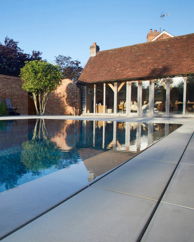How does a deck level swimming pool achieve its perfectly clean waterline?

Instead of using surface skimmers, water gently flows into a perimeter overflow channel before passing through a balance tank and back into the circulation system. 

The result is enhanced surface cleaning and a sleek, contemporary appearance.

At Guncast, we offer a variety of overflow and grille solutions tailored to each project, including:

✓ Slot overflow systems
 ✓ Stone-filled channels
 ✓ Linear drainage details
 ✓ Stainless steel grilles
 ✓ Tiled overflow channels
 ✓ Hidden collection gullies

Every detail is carefully considered to deliver both performance and exceptional design.

#Guncast #PoolEngineering #SwimmingPoolDesign #LuxuryHomes #PoolConstruction #DeckLevelPools